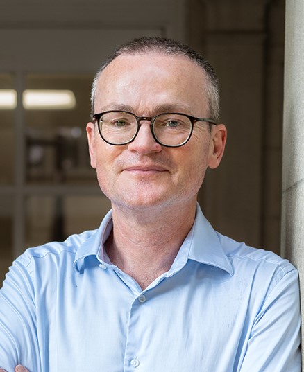 Professional headshot of Miles Larmer, Director and Graduate Coordinator