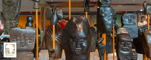 A collection of bronze busts are displayed.